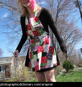 Photo of a girl wearing an apron.