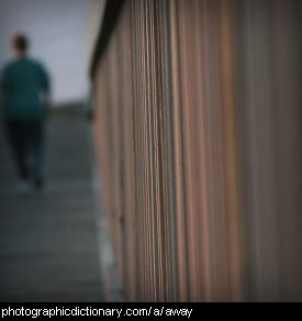 Photo of a man walking away