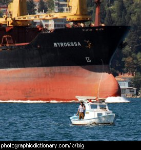 Photo of a big boat and a small boat