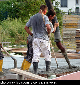 Photo of men pouring cement