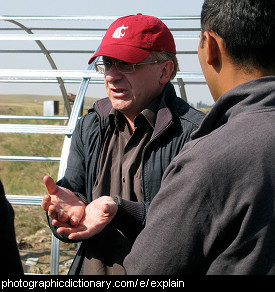 Photo of a man explaining something