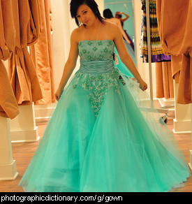 Photo of a woman wearing an aqua gown.