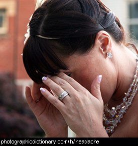 Photo of a woman with a headache