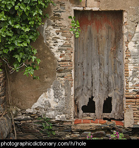 Photo of a door with two holes in it