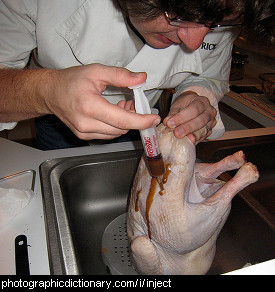 Photo of someone injecting marinade