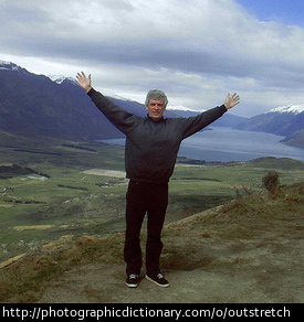 Man with outstretched arms.