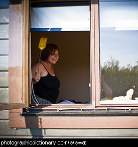 Photo of a woman with a flyswatter