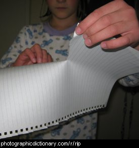 Photo of a girl tearing paper